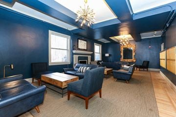 San Francisco apartment for rent - a living room with blue walls and chairs and a fireplace
