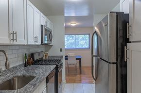 Springfield apartment for rent - a kitchen with granite counter tops and a stainless steel refrigerator