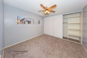 Gardena apartment for rent - a bedroom with a closet and a ceiling fan