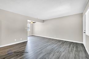 Gardena apartment for rent - the spacious living room with hardwood flooring and white walls