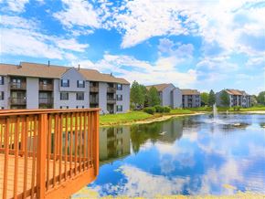 Hilliard apartment for rent - a view of a lake with apartment buildings overlooking it