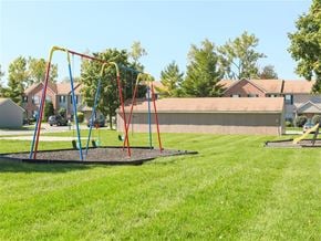 Bowling Green apartment for rent - a swing set on a playground in a park