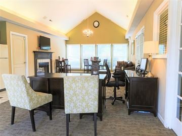 Butler apartment for rent - a living room and dining room with tables and chairs