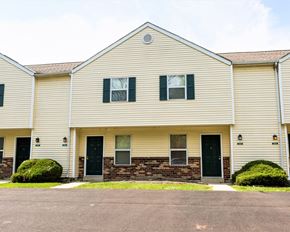 Hilliard apartment for rent - the front of a white house with black doors