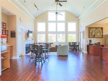 Hilliard apartment for rent - a large living room with a ceiling fan and a large window