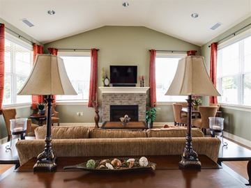 Raleigh apartment for rent - a living room with a couch and a fireplace