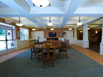 Wauchula apartment for rent - A dining room with a wooden table and chairs.