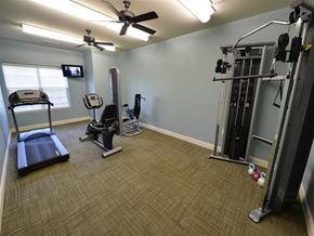 Kent apartment for rent - A well-equipped gym with treadmills, weights, and exercise machines.