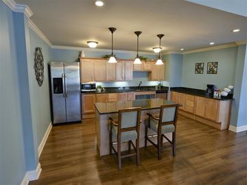 Kent apartment for rent - A kitchen with a table and chairs in the middle.