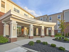 Columbus apartment for rent - A building with a covered walkway entrance and pillars.