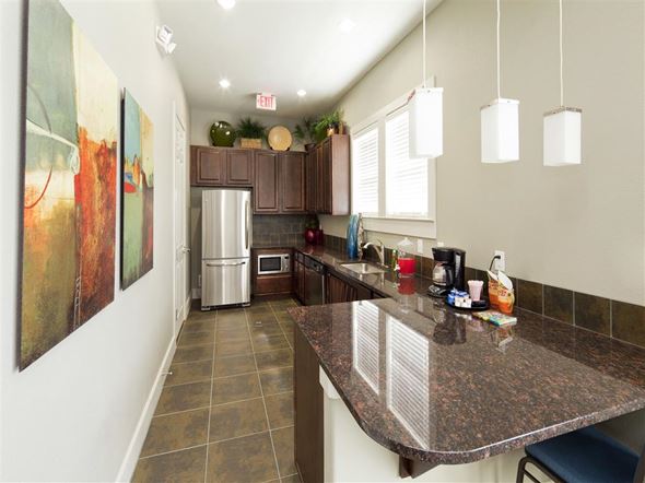 San Marcos apartment for rent - Resident coffee bar and refreshment station featuring granite countertops, seating space, and complimentary beverage amenities