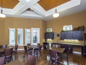 San Antonio apartment for rent - a dining room with tables and chairs and a bar