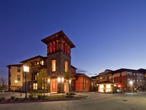 Houston apartment for rent - A large building with a tower lit up at night.