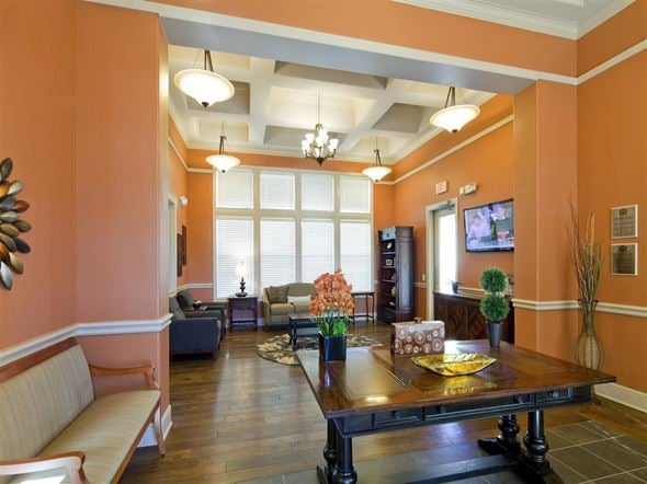 Laredo apartment for rent - A living room with a wooden table and a sofa.
