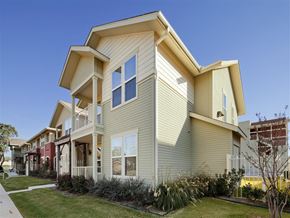 Fort Worth apartment for rent - A modern two-story house with a balcony on the second floor.