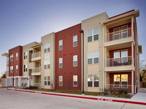 Fort Worth apartment for rent - Apartment building with balconies and multiple windows.