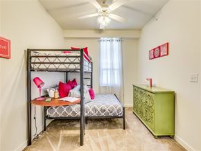 Dallas apartment for rent - A bedroom with a bunk bed and a green chest of drawers.