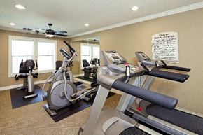 San Antonio apartment for rent - A gym with a variety of equipment including treadmills, stationary bikes, and elliptical machines.