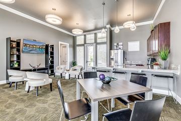 Denton apartment for rent - A modern living room with a dining table and chairs.
