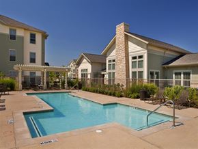 Fort Worth apartment for rent - A pool surrounded by a patio and chairs with a sign that says "No Diving".