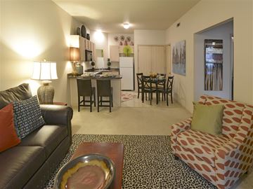 Fayetteville apartment for rent - a living room and kitchen with a couch and a table