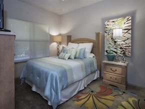 Fayetteville apartment for rent - a bedroom with a bed and a painting on the wall