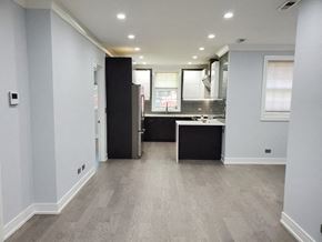 Chicago apartment for rent - an empty kitchen with a sink and a refrigerator