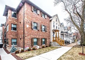 Chicago apartment for rent - a brick house with a sidewalk in front of it