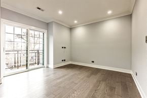 Chicago apartment for rent - the living room of a new home with white walls and wood floors