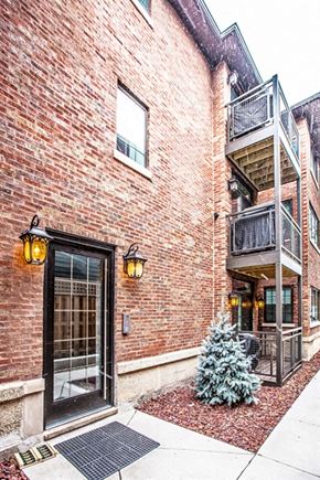 Chicago apartment for rent - the exterior of a brick house with a glass door