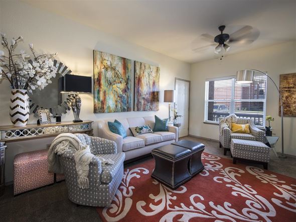 Fayetteville apartment for rent - a living room with furniture and a ceiling fan
