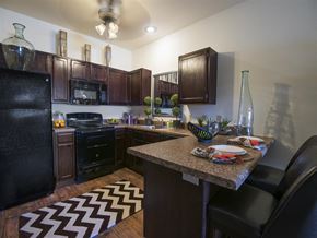 Fayetteville apartment for rent - a kitchen with black appliances and a granite counter top