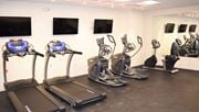 Perth Amboy apartment for rent - a group of exercise machines in a gym