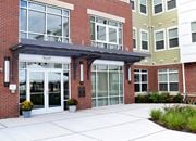Perth Amboy apartment for rent - the entrance to a building with large glass doors