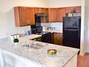 Perth Amboy apartment for rent - a kitchen with black appliances and granite counter tops