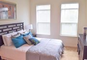 Perth Amboy apartment for rent - a bedroom with a bed and two windows