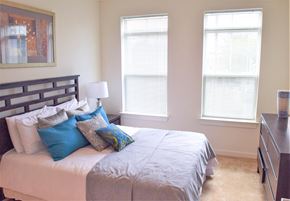Perth Amboy apartment for rent - a bedroom with a bed and two windows