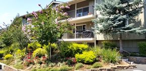 Los Gatos apartment for rent - an apartment building with a garden in front of it