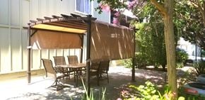 Los Gatos apartment for rent - a patio with a table and chairs covered by a canopy