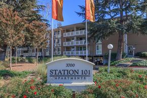 Santa Clara apartment for rent - front building sign with flags