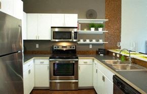Grand Rapids apartment for rent - a kitchen with stainless steel appliances and white cabinets