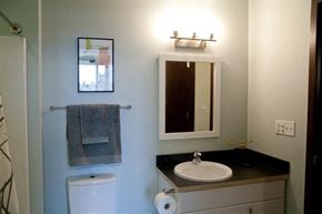 Grand Rapids apartment for rent - a bathroom with a sink and a mirror and a toilet