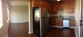 San Francisco apartment for rent - an empty kitchen with a stainless steel refrigerator