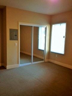 San Francisco apartment for rent - an empty living room with sliding glass doors