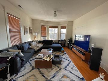 Seattle apartment for rent - a living room with a couch and a tv