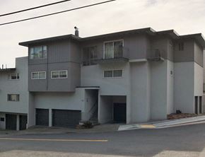 San Francisco apartment for rent - a white apartment building with a street in front of it
