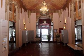 San Francisco apartment for rent - a large room with a chandelier and a door