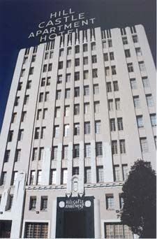 Oakland apartment for rent - a tall building with a sign on top of it