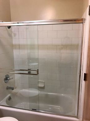 San Francisco apartment for rent - a white bathroom with a shower and a tub