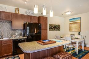 Bradenton apartment for rent - a kitchen and dining room with a table and chairs